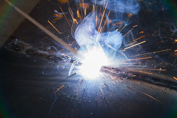 During SMAW, the covering of the electrode disintegrates to form protective gases