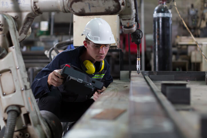 Worker inspecting his project after welder training