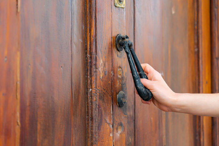 Cabinet making training grad uses rusted hand knocker