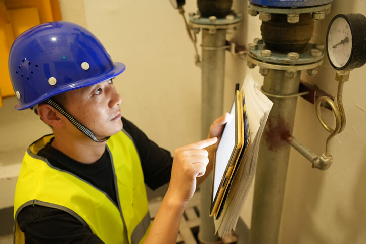 Home inspector checking a home’s plumbing fixtures after home inspection training.