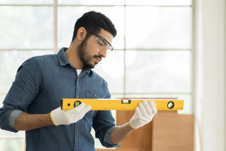 Carpenter working in a workshop after home renovation training