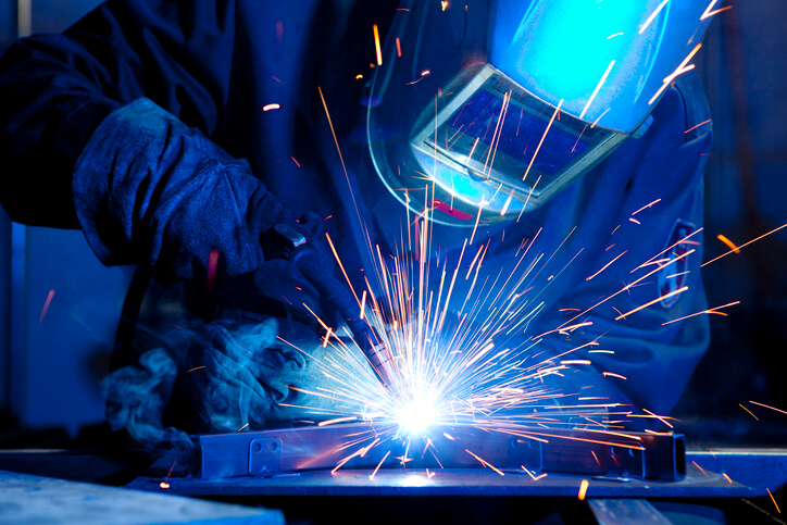 welder training grad welding a metal frame