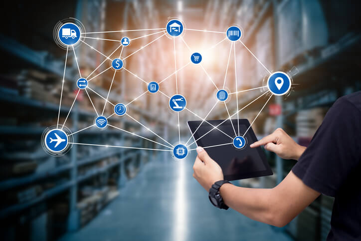 A logistics manager using logistics software after logistics management training.