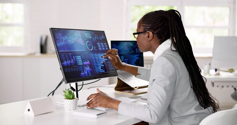 A female supply chain professional working in an office after supply chain and logistics training