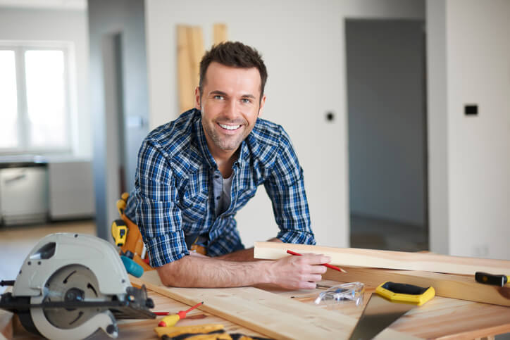 A home renovation technician at a worksite after completing home renovation training
